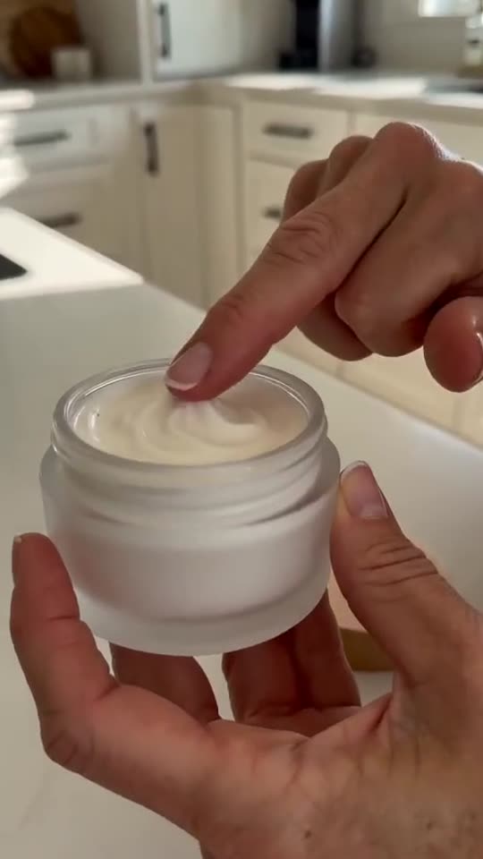 Product in hand: the cream texture, close up. Product is made up.